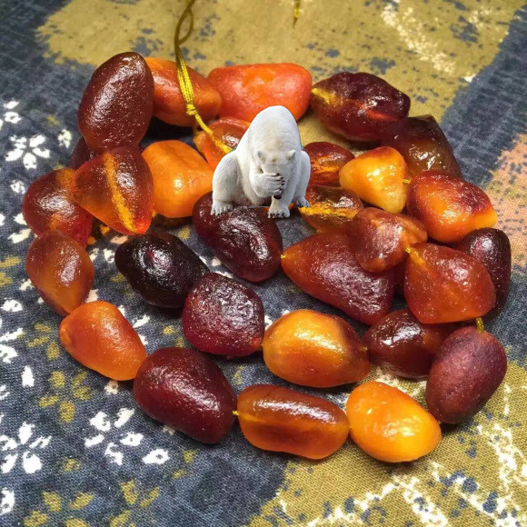 海漂籽料和蜜蠟有什么區別_蜜蠟海漂籽料手串圖片_蜜蠟海漂籽料盤玩變化圖